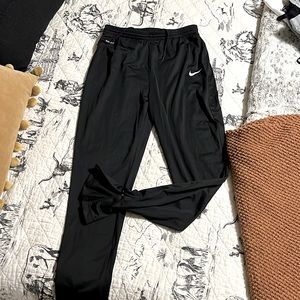 Nike Dri-fit track pants. Zip ankle. Black size M